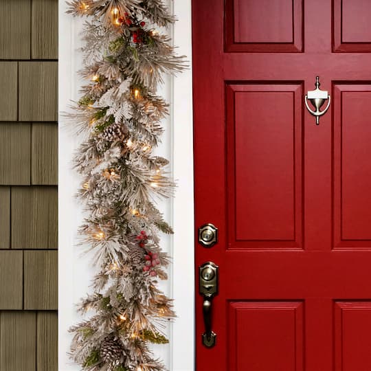 9ft. Pre-lit Snowy Bedford Pine Artificial Christmas Garland with Cedar Leaves, Red Berries, Mixed Cones & 70 Warm White Battery Operated LED Lights w/Timer